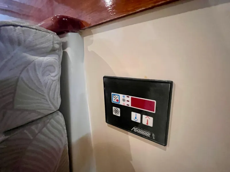 Slide: The Image of Control panel on 2005 Hinckley Picnic Boat EP interior, near patterned upholstery. - 37