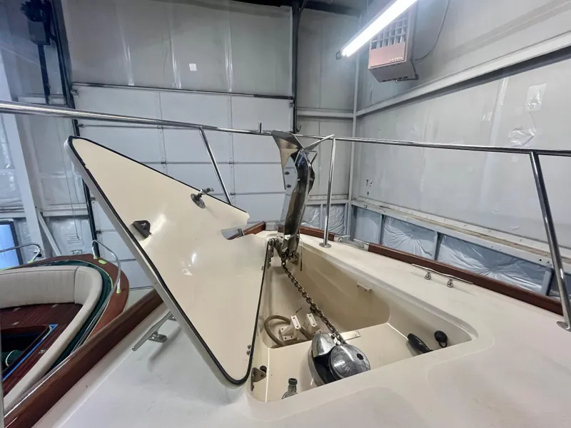 Slide: The Image of 2005 Hinckley Picnic Boat EP anchor compartment in a garage setting. - 40