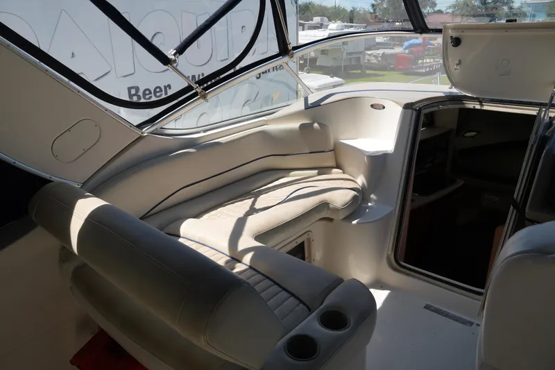Slide: The Image of 2003 Bayliner Ciera 2855 interior with seating and cup holders, showcasing a sleek design. - 11