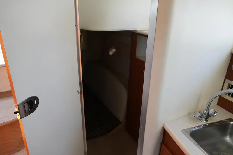 Slide: The Image of 2003 Bayliner Ciera 2855 cabin interior with sink and doorway. - 19