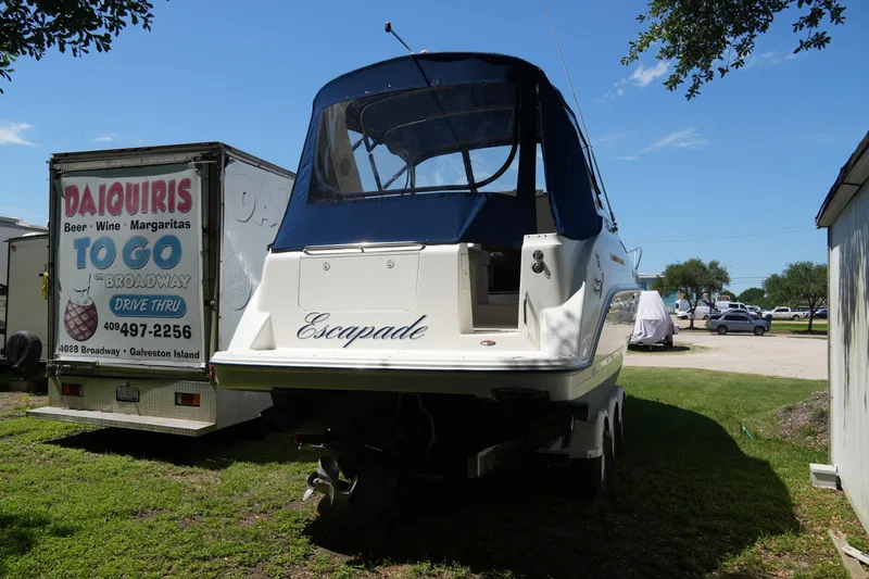 Slide: The Image of 2003 Bayliner Ciera 2855 boat parked near a daiquiri trailer. - 2