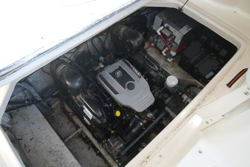 Slide: The Image of Engine compartment of a 2003 Bayliner Ciera 2855 boat, showcasing the engine and components. - 22