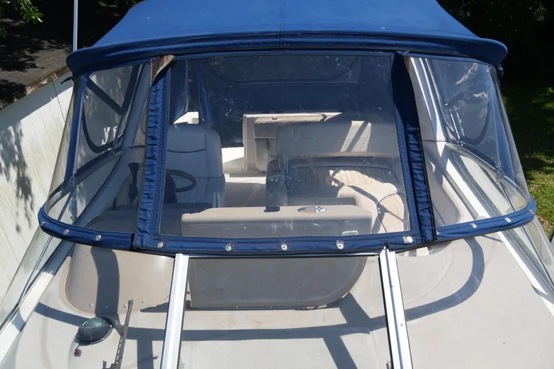Slide: The Image of 2003 Bayliner Ciera 2855 boat with blue canopy and clear windshield. - 8