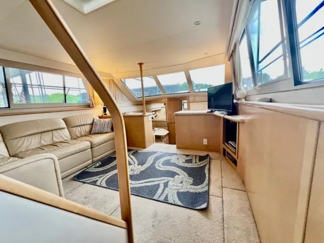 Slide: The Image of Luxurious interior of 1998 Carver 405 Motor Yacht with plush seating and modern amenities. - 30