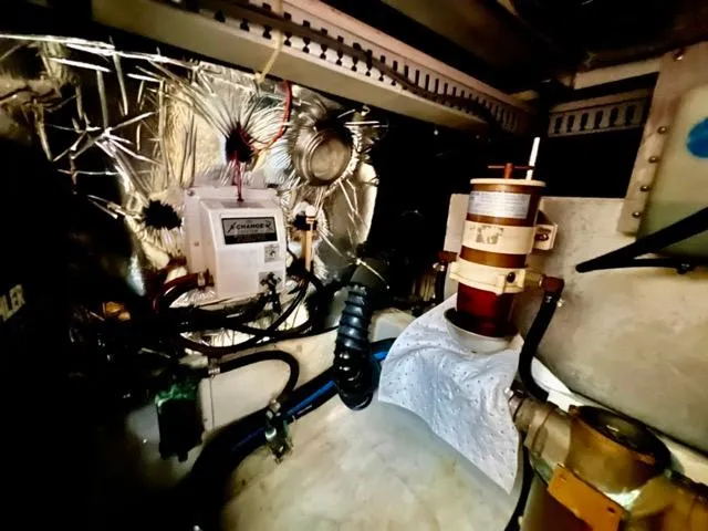 Slide: The Image of Engine room of 1998 Carver 405 Motor Yacht with mechanical components and wiring. - 34