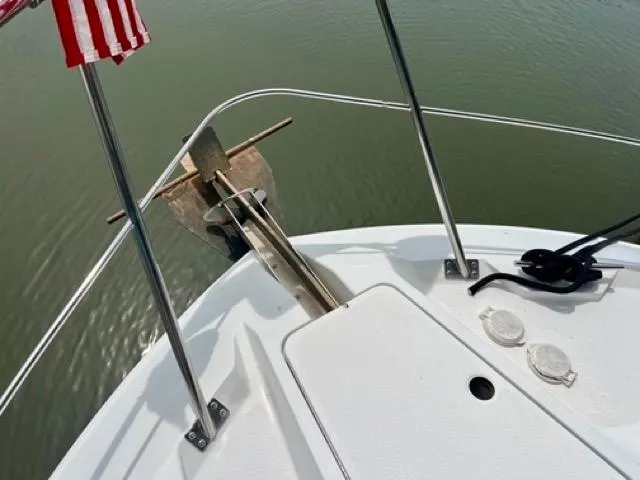 Slide: The Image of Bow of 1998 Carver 405 Motor Yacht with anchor and American flag. - 37