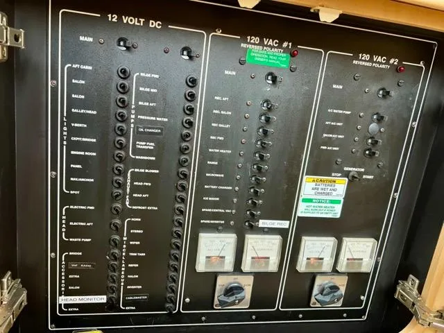 Slide: The Image of Electrical panel of a 1998 Carver 405 Motor Yacht, showing 12V DC and 120V AC systems. - 40
