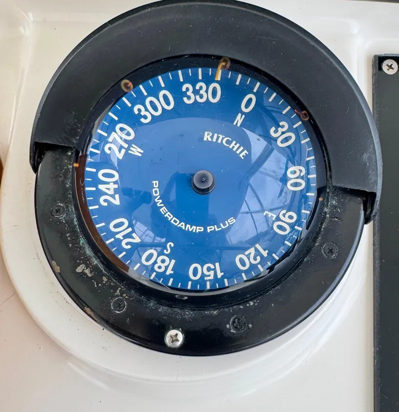 Slide: The Image of Compass on Liberty 42 Express boat, 2000 model, showing cardinal directions. - 26
