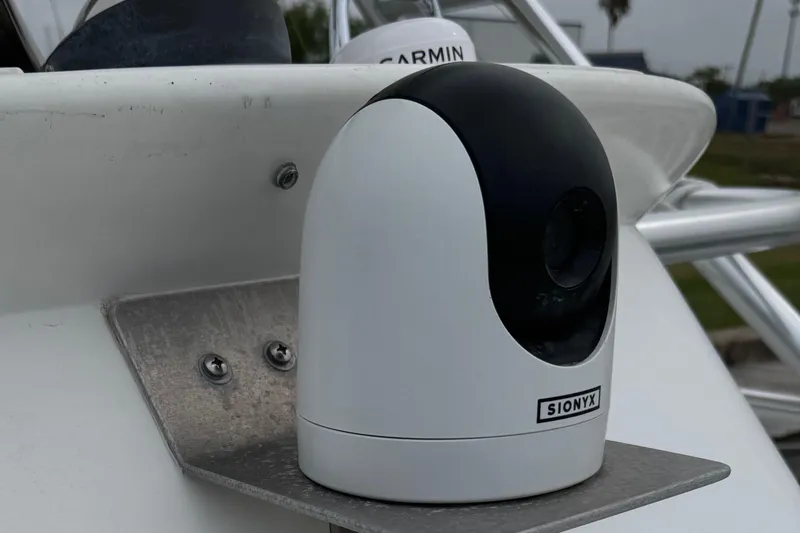 Slide: The Image of SIONYX camera mounted on a 2000 Liberty 42 Express boat, with Garmin equipment visible. - 27