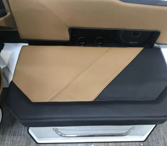 Slide: The Image of 2024 Cobalt R6 Surf interior with tan and black seating, showcasing modern design and comfort. - 12