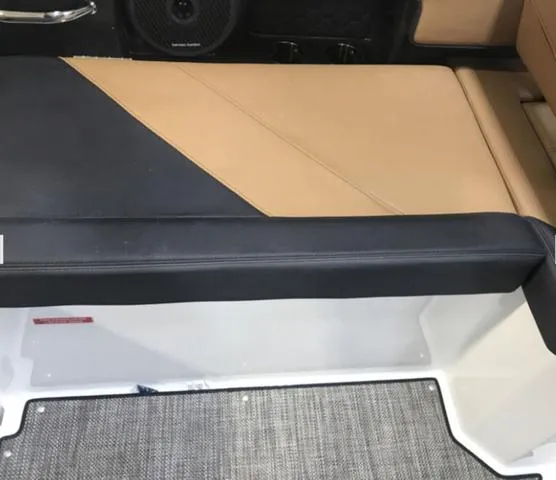 Slide: The Image of 2024 Cobalt R6 Surf boat interior with tan and black seating. - 14