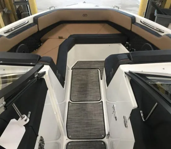 Slide: The Image of 2024 Cobalt R6 Surf boat interior with luxurious seating and modern design. - 4