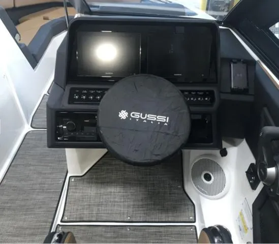 Slide: The Image of 2024 Cobalt R6 Surf boat dashboard with Gussi Italia steering wheel cover. - 7