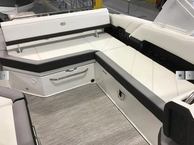 Slide: The Image of 2024 Cobalt R8 boat interior with sleek white seating and modern design. - 14