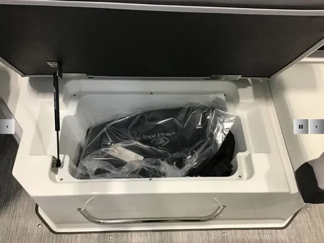 Slide: The Image of 2024 Cobalt R8 storage compartment with cover in plastic packaging. - 16