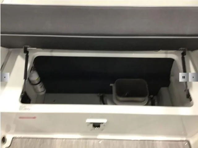 Slide: The Image of 2024 Cobalt R8 storage compartment with open lid, showcasing interior space and equipment. - 18