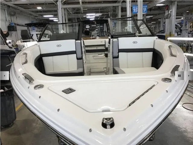 Slide: The Image of 2024 Cobalt R8 boat interior in a factory setting, showcasing sleek seating and modern design. - 3