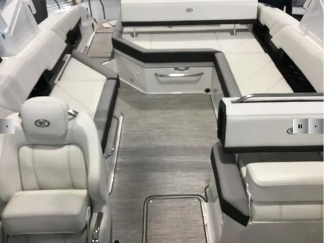 Slide: The Image of 2024 Cobalt R8 boat interior with luxurious white seating and modern design. - 7