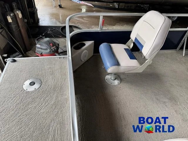 Slide: The Image of 2012 Weeres Cadet 200 Pontoon interior with seating and carpeted deck. - 10