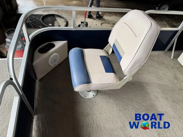 Slide: The Image of 2012 Weeres Cadet 200 Pontoon seat with blue and white upholstery, featuring a speaker and cup holder. - 11