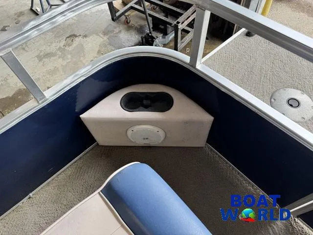 Slide: The Image of 2012 Weeres Cadet 200 Pontoon interior with seating and speaker, Boat World logo visible. - 17