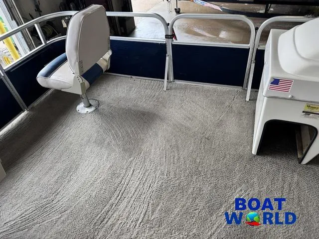 Slide: The Image of 2012 Weeres Cadet 200 Pontoon interior with seating and carpeted floor. - 20