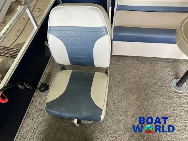 Slide: The Image of 2012 Weeres Cadet 200 Pontoon interior with blue and white seating. - 23