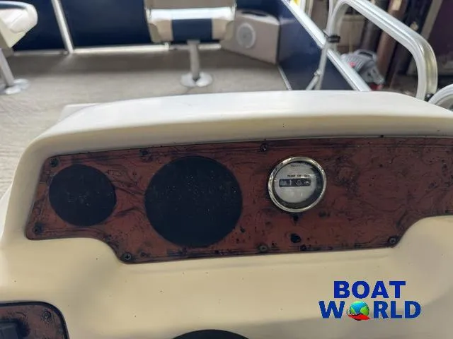 Slide: The Image of 2012 Weeres Cadet 200 Pontoon dashboard with gauge and speaker slots. - 25