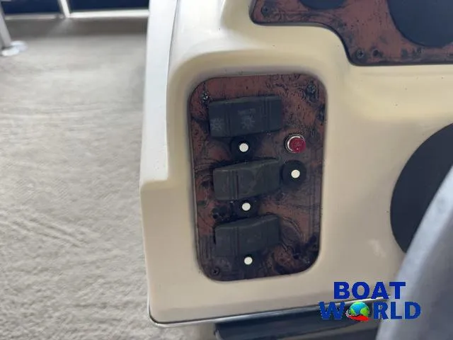 Slide: The Image of Control panel of 2012 Weeres Cadet 200 Pontoon with switches and indicator light. - 26