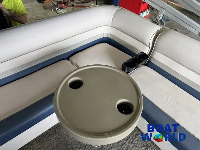 Slide: The Image of 2012 Weeres Cadet 200 Pontoon interior with seating and cup holders. - 29