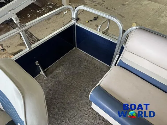 Slide: The Image of 2012 Weeres Cadet 200 Pontoon interior with blue and beige seating, Boat World logo visible. - 31
