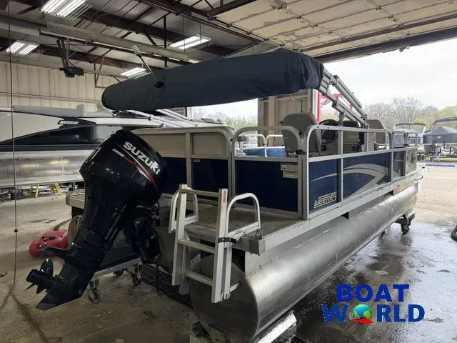Slide: The Image of 2012 Weeres Cadet 200 Pontoon with Suzuki outboard motor in a boat showroom. - 37