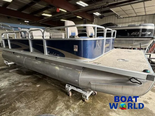 Slide: The Image of 2012 Weeres Cadet 200 Pontoon boat in a warehouse, featuring blue and silver design. - 41