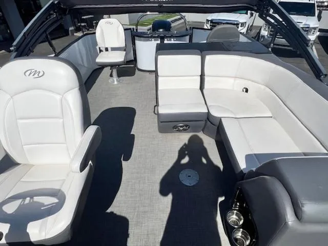 Slide: The Image of 2021 Manitou 23 Aurora LE VP pontoon boat interior with plush seating and modern design. - 12