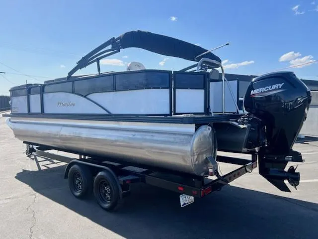 Slide: The Image of 2021 Manitou 23 Aurora LE VP pontoon boat on trailer with Mercury outboard motor. - 8