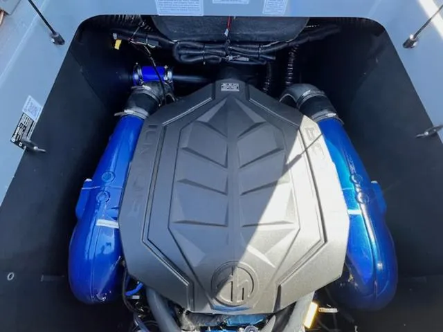 Slide: The Image of 2025 MasterCraft XT23 engine compartment with blue accents and sleek design. - 22