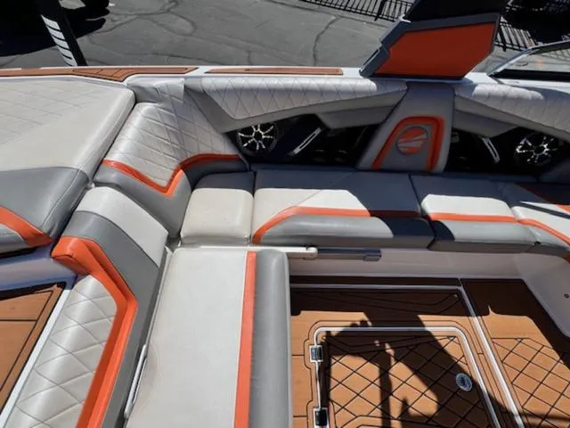 Slide: The Image of 2017 Tigé RZX2 boat interior with orange and gray seating, featuring stylish design and premium materials. - 13