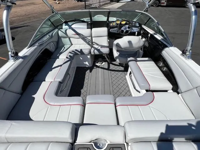 Slide: The Image of 2006 MasterCraft X30 boat interior with spacious seating and modern dashboard. - 11