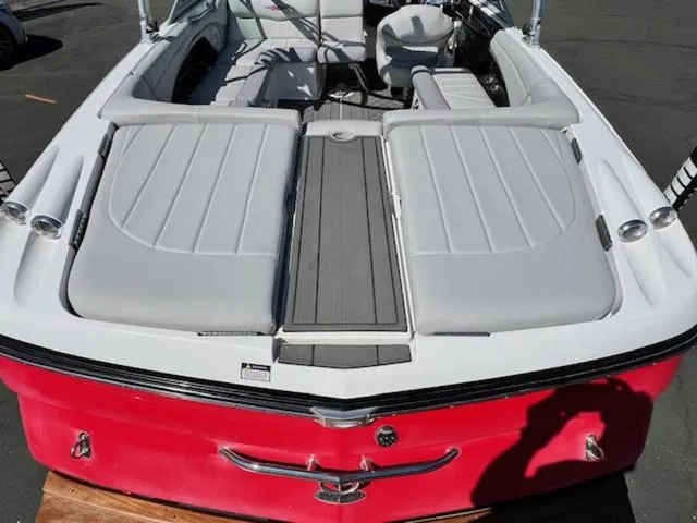 Slide: The Image of 2006 MasterCraft X30 boat with red exterior and spacious seating area. - 9