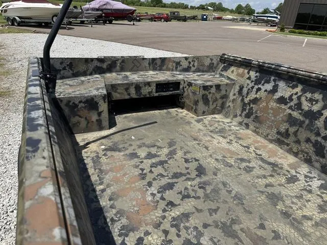 Slide: The Image of 2023 Thor Boats Lake Hammer Standard with camouflage interior, parked outdoors. - 8