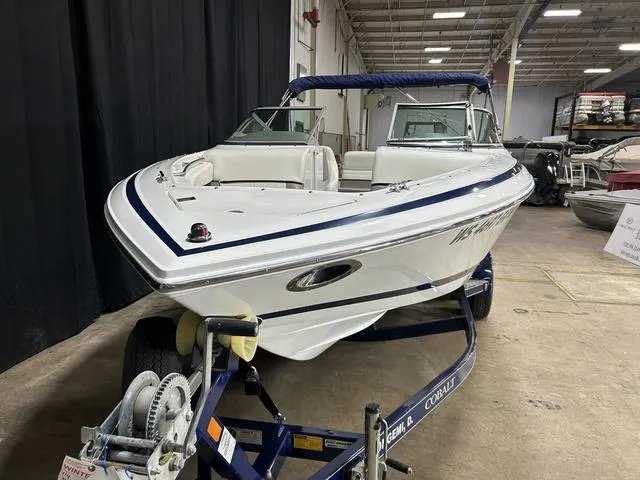 Slide: The Image of 2003 Cobalt 226 boat on trailer in indoor storage facility. - 13