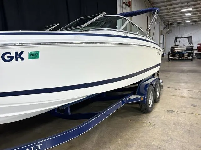 Slide: The Image of 2003 Cobalt 226 boat on trailer in indoor storage facility. - 15
