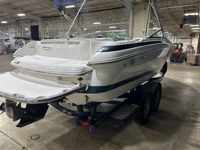Slide: The Image of 2003 Cobalt 226 boat on trailer in indoor storage facility. - 18