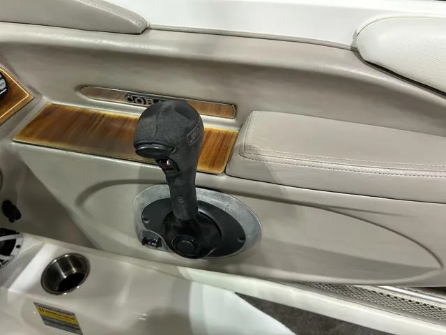 Slide: The Image of Interior of a 2003 Cobalt 226 boat featuring a throttle control lever. - 26
