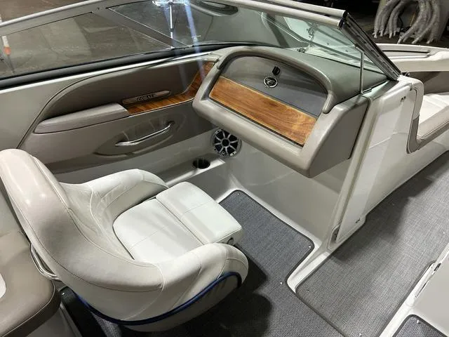 Slide: The Image of Interior of a 2003 Cobalt 226 boat, featuring a sleek dashboard and comfortable seating. - 28