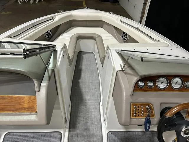 Slide: The Image of 2003 Cobalt 226 boat interior with dashboard, seating, and steering wheel in a garage setting. - 29