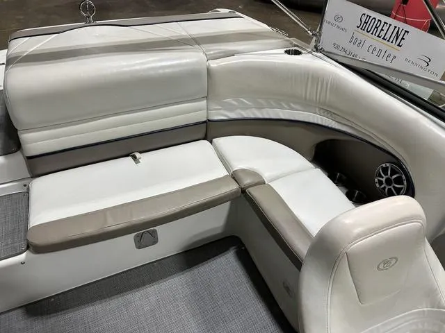 Slide: The Image of 2003 Cobalt 226 boat interior with white and beige seating at Shoreline Boat Center. - 33
