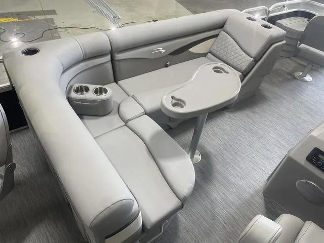 Slide: The Image of 2023 Bennington 20 SVF boat interior with gray seating and cup holders. - 10