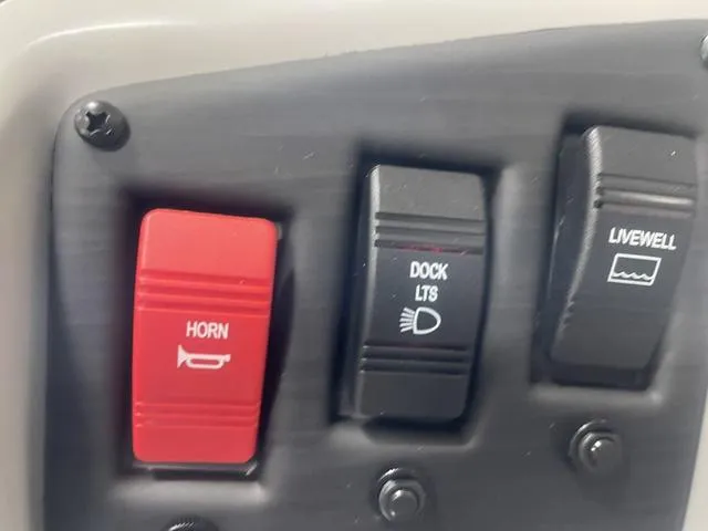Slide: The Image of Control panel of 2023 Bennington 20 SVF with horn, dock lights, and livewell switches. - 13