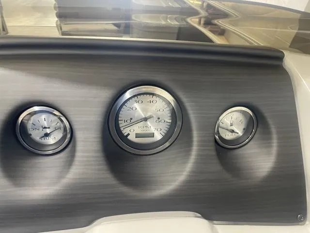Slide: The Image of Dashboard gauges of 2023 Bennington 20 SVF boat, featuring speedometer and trim indicators. - 14